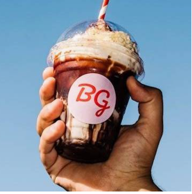 Sundae shake held to the sky