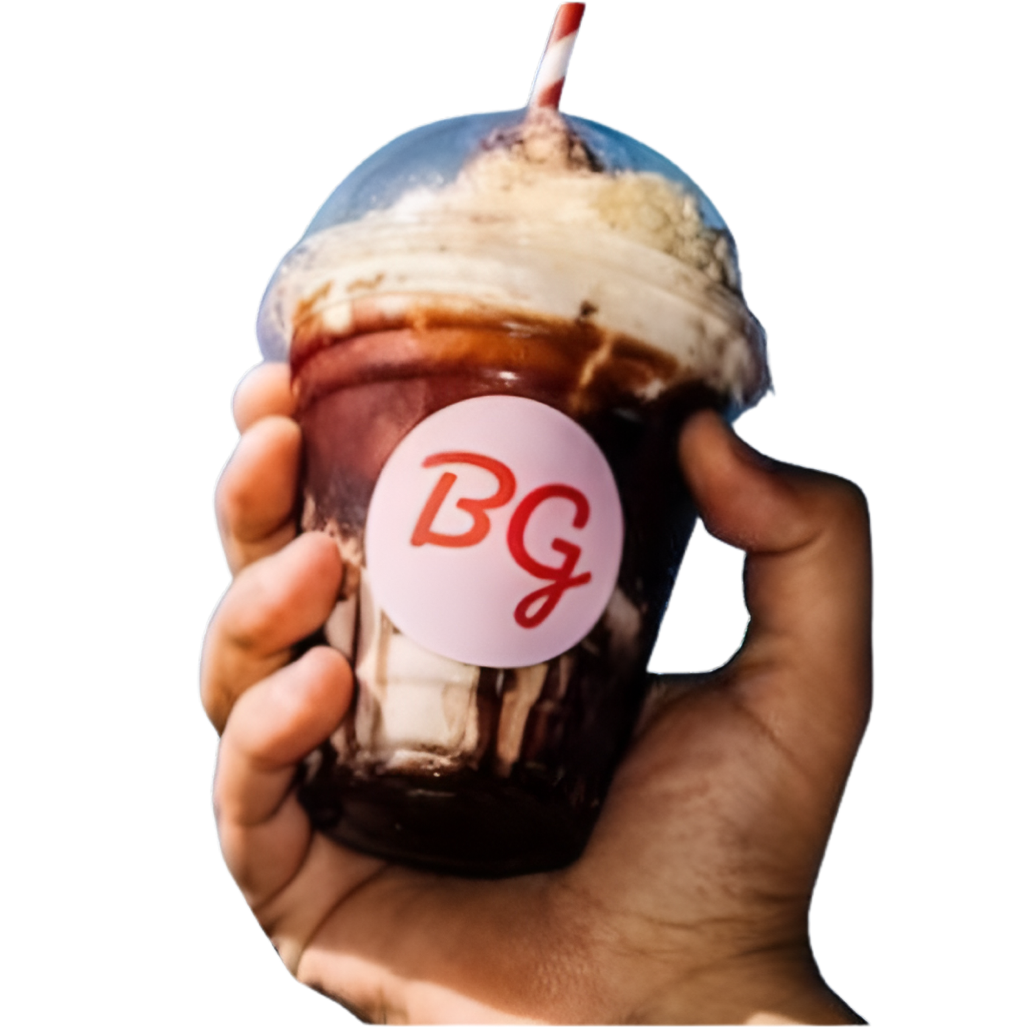 Hand holding a By George chocolate sundae shake against a blue sky
